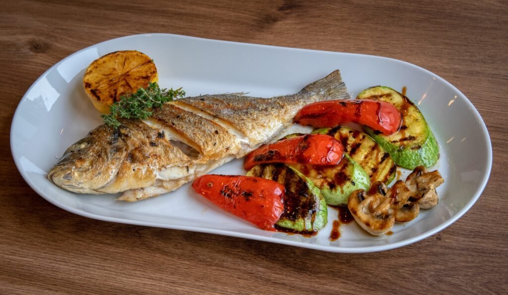 fish with vegetables on the plate